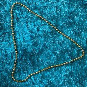 Golden plastic spherical beads necklace (slightly longer)